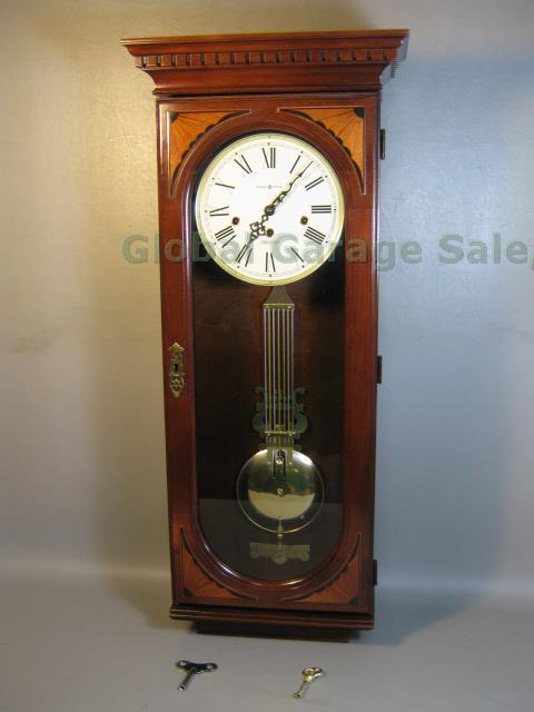 Howard Miller Ambassador Collection Lewis Triple Chime Wood Wall Clock #613-637