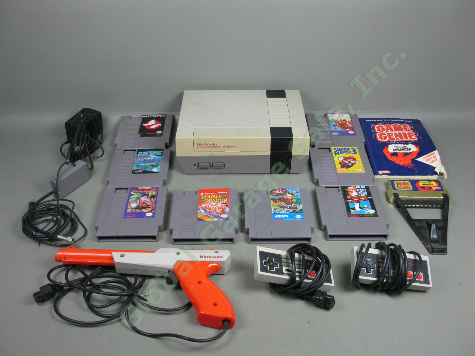 Nintendo NES-001 Console System 8 Games 2 Controllers Zapper Gun Game Genie Lot