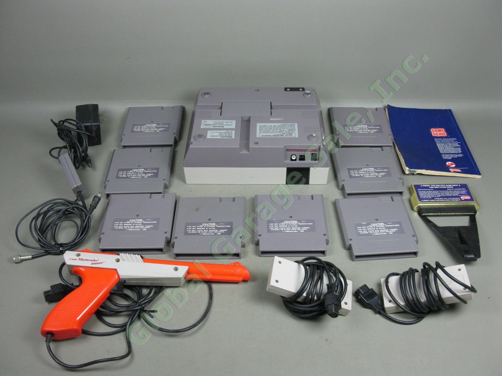 Nintendo NES-001 Console System 8 Games 2 Controllers Zapper Gun Game Genie Lot 1