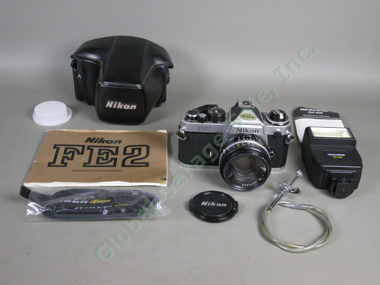 Nikon FE2 35mm Camera Nikkor 50mm f/1.8 Lens Case Manual Promaster Flash Bundle