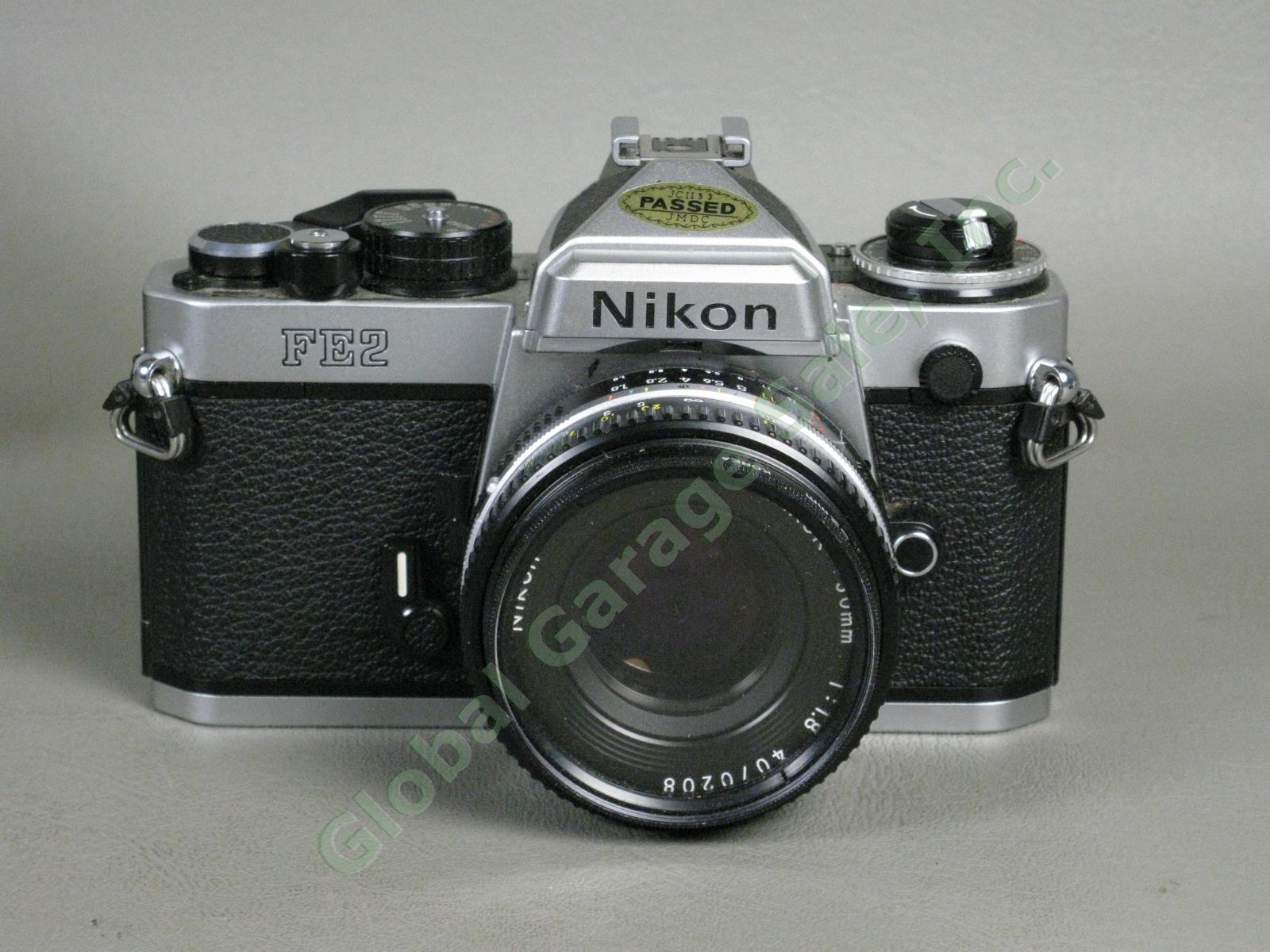 Nikon FE2 35mm Camera Nikkor 50mm f/1.8 Lens Case Manual Promaster Flash Bundle 1