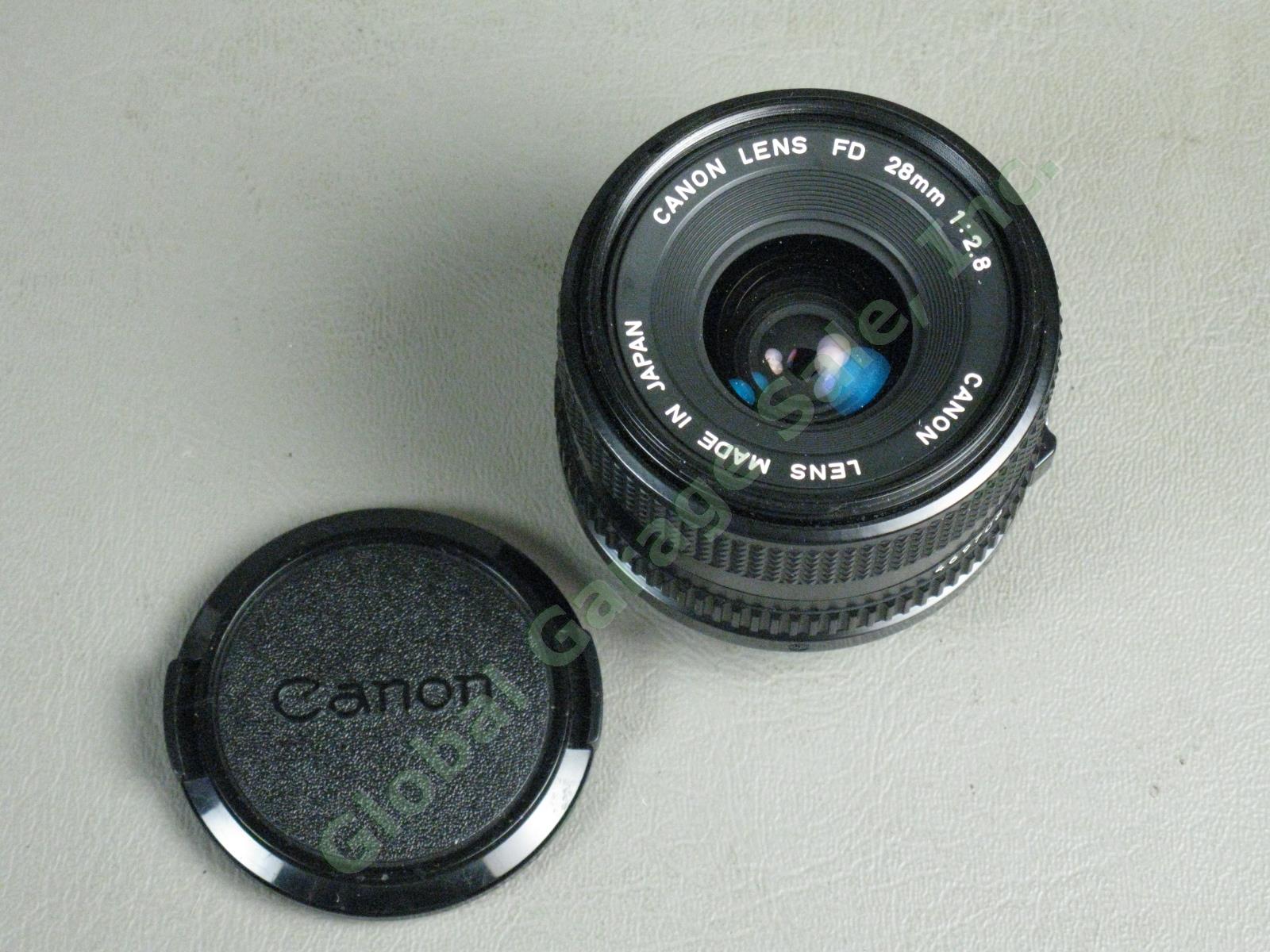 Canon A1 35mm Camera Bundle FD 50mm 1:1.8 FD 28mm 1:2.8 Vivitar 75-205mm Zoom ++ 11