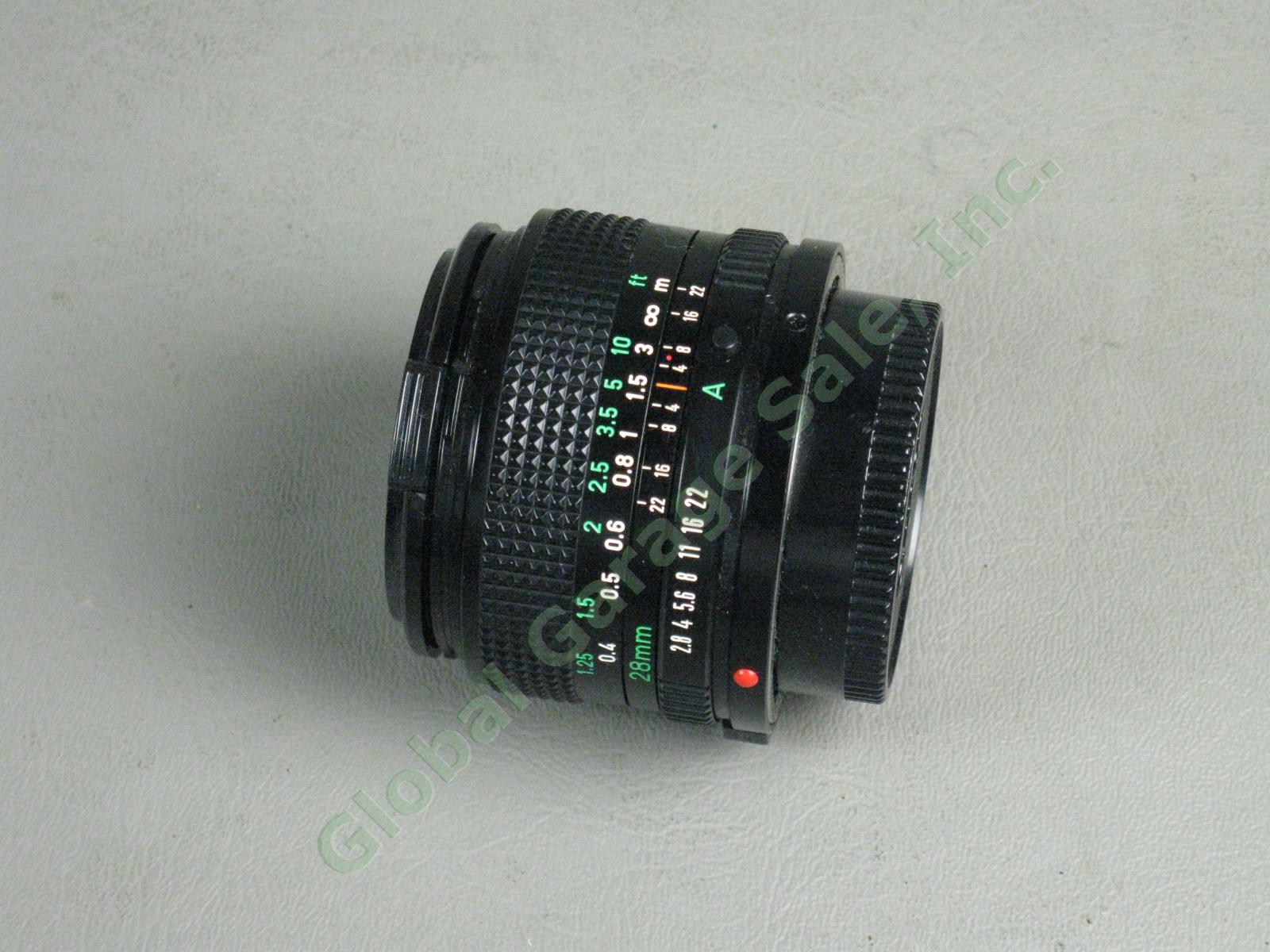 Canon A1 35mm Camera Bundle FD 50mm 1:1.8 FD 28mm 1:2.8 Vivitar 75-205mm Zoom ++ 12